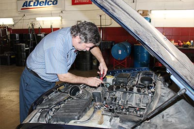 Mechanic working on a car at our San Pedro Location | Belden's Automotive & Tires