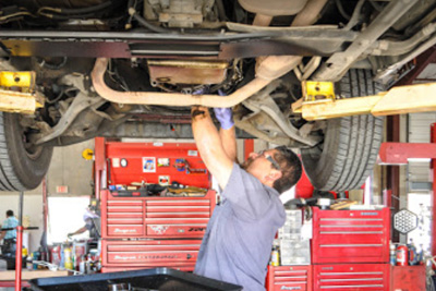 Mechanic working on a car at our Prue Road Location | Belden's Automotive & Tires
